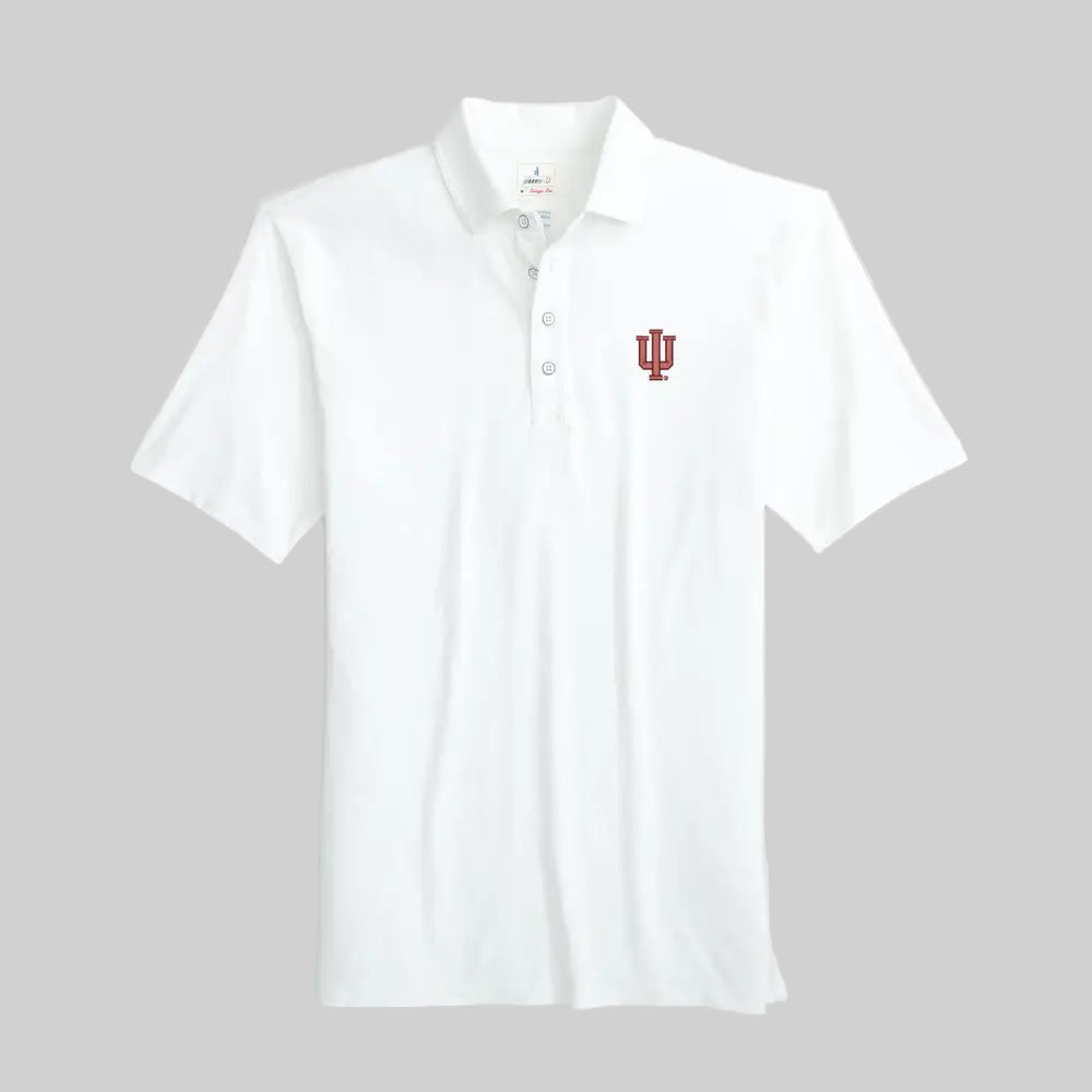 White polo shirt with a red logo on a light gray background